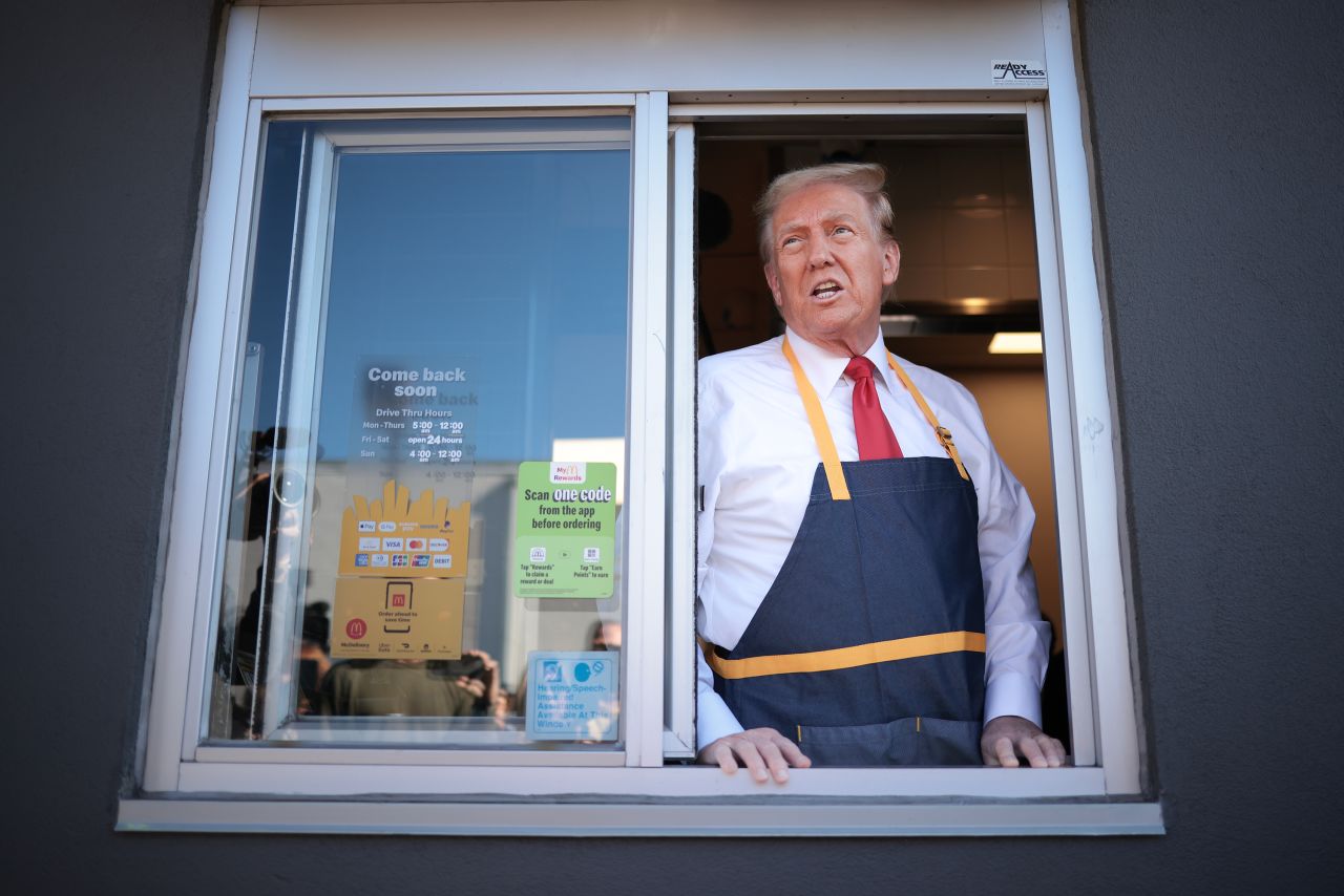 Former President Donald Trump answers questions as he works the drive-thru line at a McDonald's restaurant on October 20, in Feasterville-Trevose, Pennsylvania.