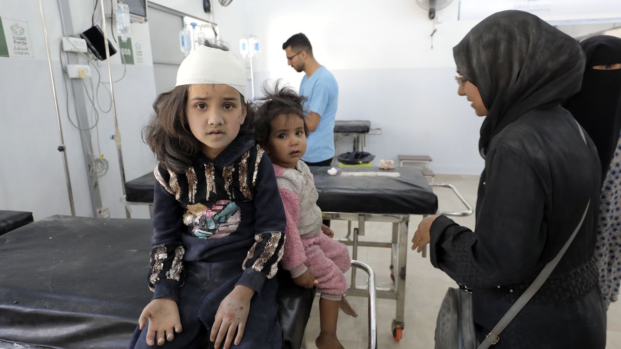 Wounded people, including children and women, are brought to Al-Awda Hospital for treatment after the Israeli army attacked a school sheltering displaced Palestinians at Nuseirat refugee camp, Gaza, on October 24.