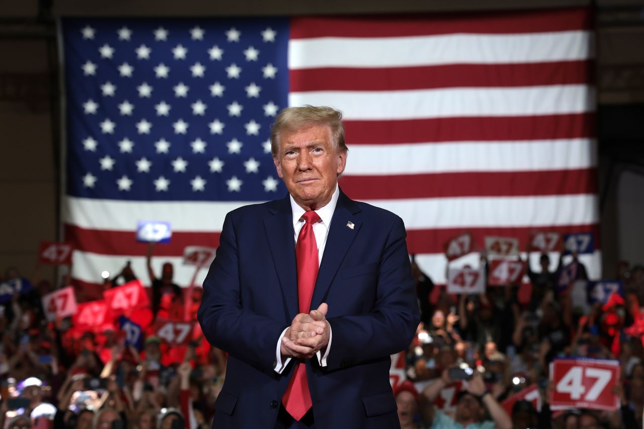 Former President Donald Trump takes the stage during a town hall event on October 20 in Lancaster, Pennsylvania.