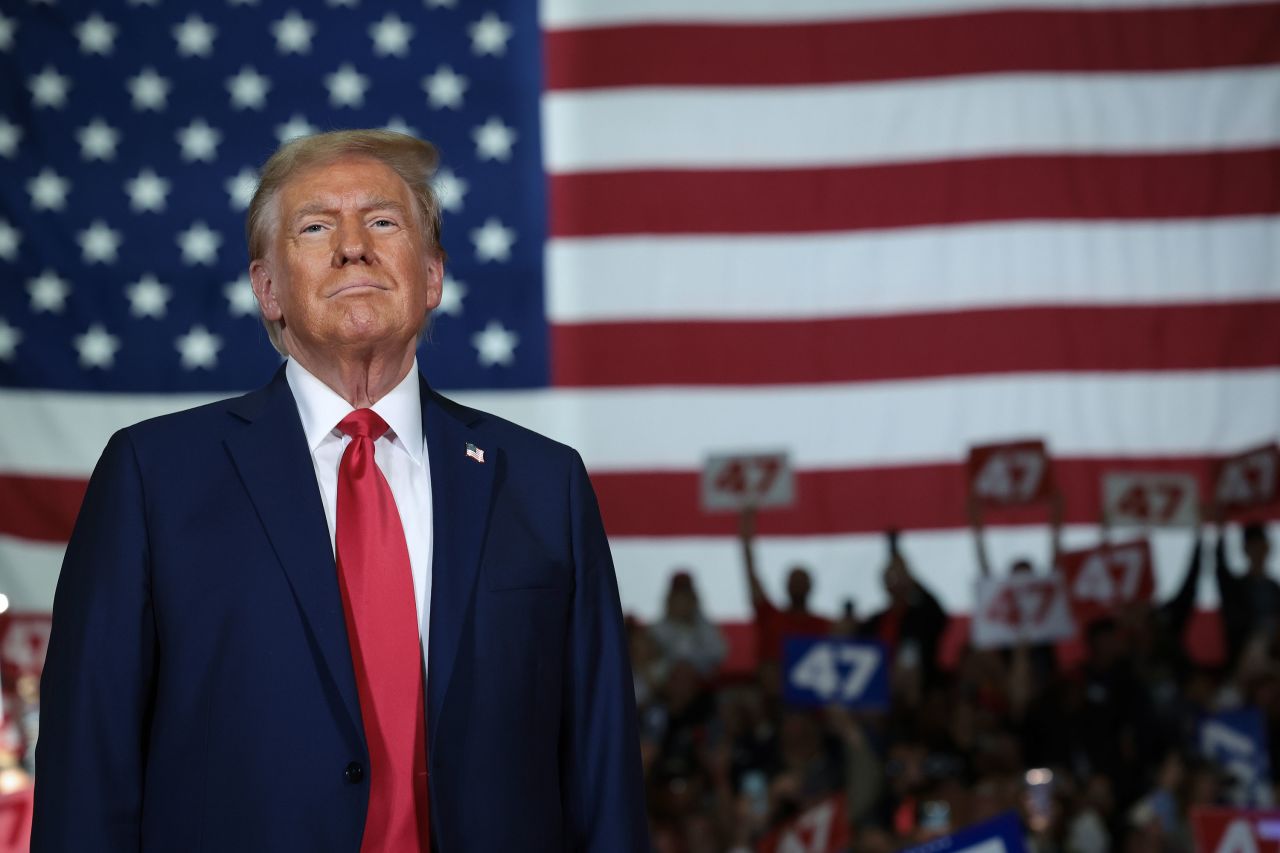 Donald Trump arrives on stage during a town hall campaign event in Lancaster, Pennsylvania, on October 20, 2024.