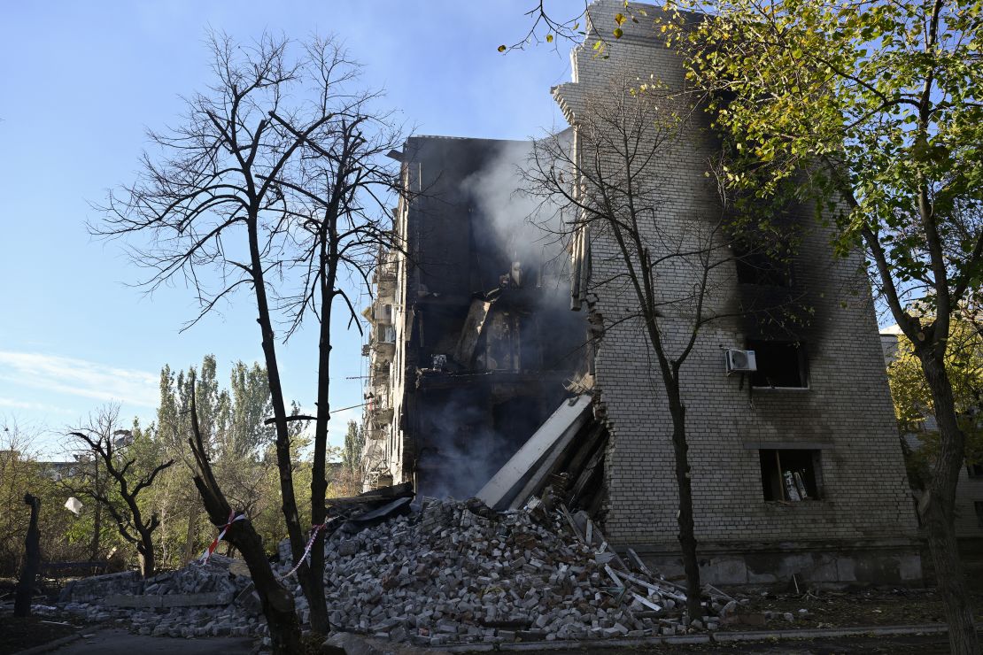 Smoke rises from the debris of a residential building in the town of Lyman, Donetsk region, on October 24.