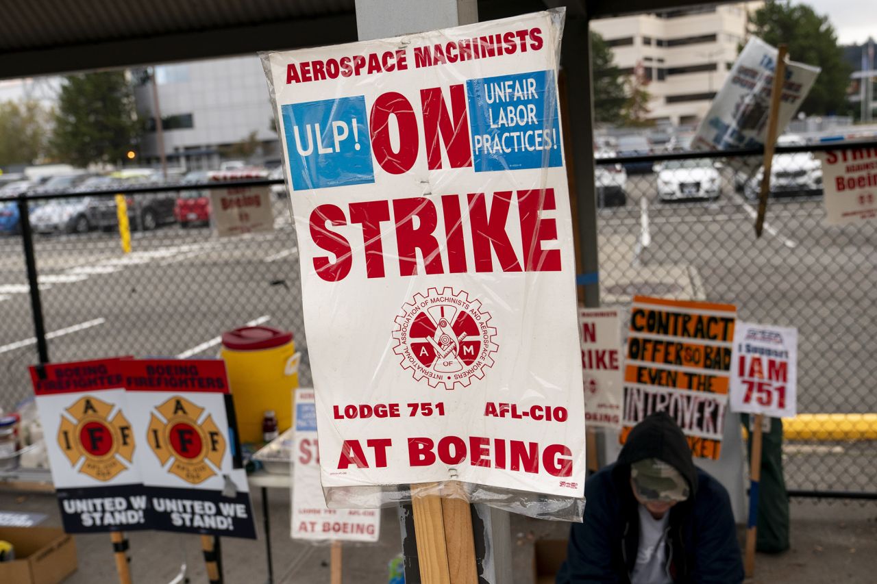 A strike sign is seen on display as Boeing workers gather on a picket line near the entrance to a Boeing facility during an ongoing strike October 24 in Seattle, Washington.