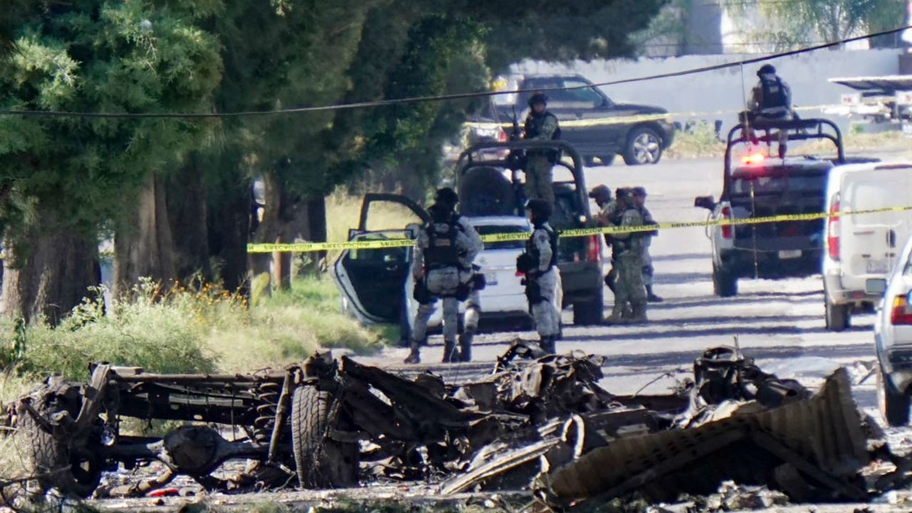 Forensic experts work at the site of a bomb car blast in front of the municipal Public Security Secretariat, which left three municipal police officers injured, in the municipality of Acambaro, state of Guanajuato, Mexico, on October 24, 2024. Guanajuato, a thriving industrial center that is also home to popular tourist destinations such as the colonial city of San Miguel de Allende, is currently considered Mexico's most violent state, according to official homicide statistics. (Photo by Mario ARMAS / AFP) (Photo by MARIO ARMAS/AFP via Getty Images)