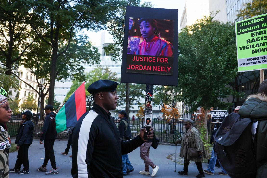 Protesters gather outside of a New York City courthouse as jury selection begins in Daniel Penny's trial on October 21, 2024.