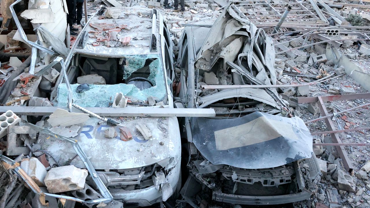 Destroyed cars at the site of an Israeli airstrike that targeted an area where a number of journalists were located in the southern Lebanese village of Hasbaiya on October 25.