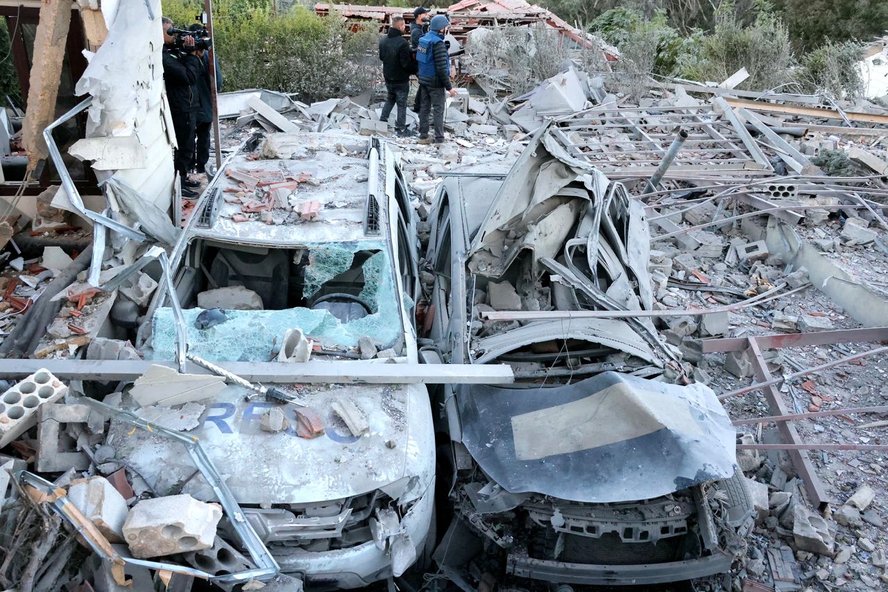 Destroyed cars at the site of an Israeli airstrike that targeted an area where a number of journalists were located in the southern Lebanese village of Hasbaiya on October 25.