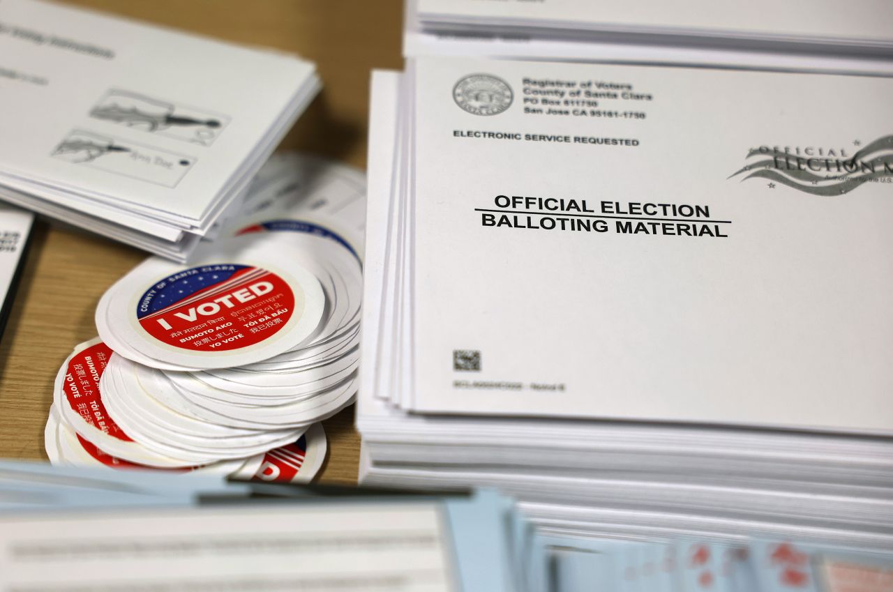 Election materials are displayed on a table at the Santa Clara County registrar of voters office on October 21 in San Jose, California.