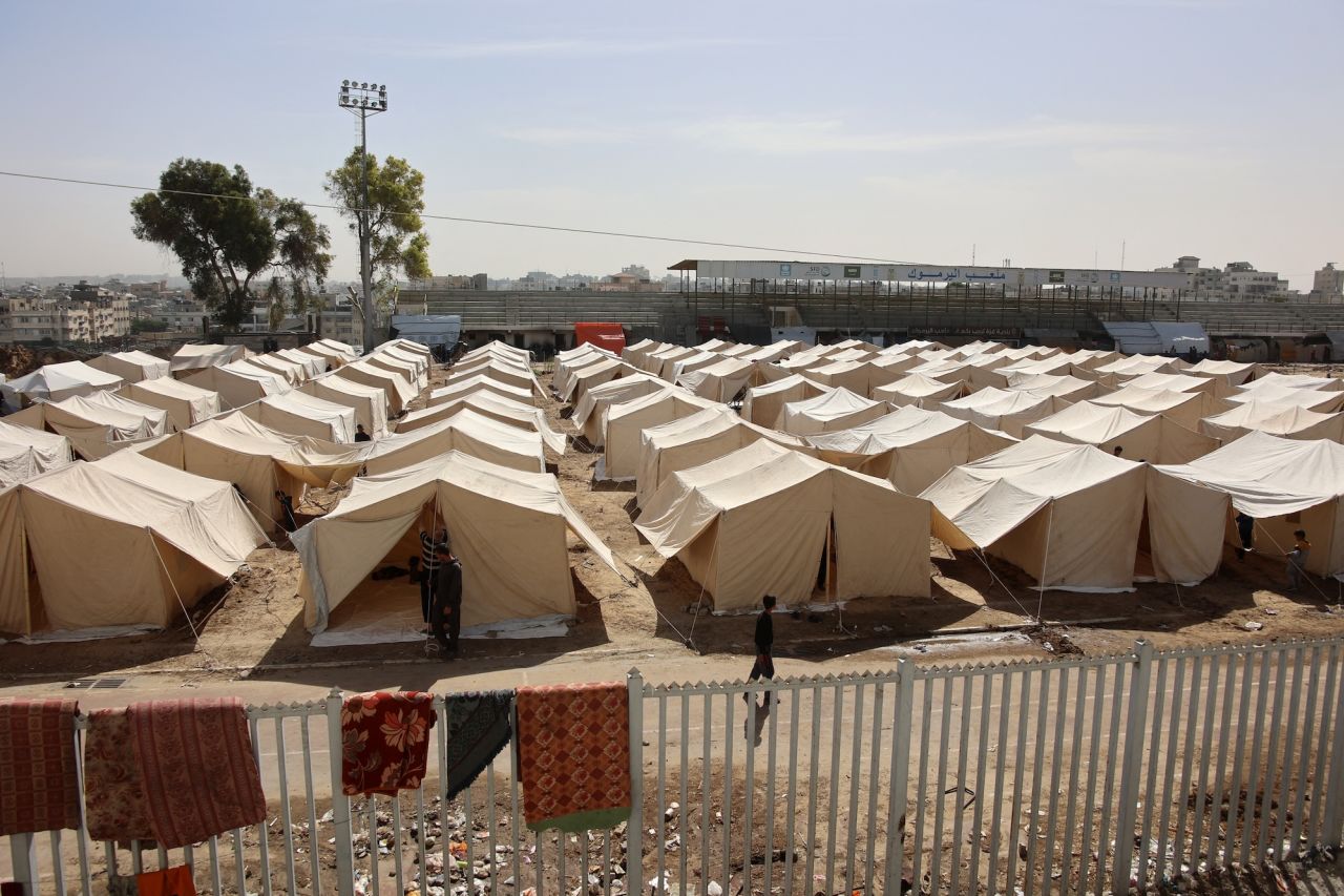 Displaced Palestinians set up tents to be used as temporary shelters at the Yarmouk Sports Stadium, once a football arena, in Gaza City on Friday.