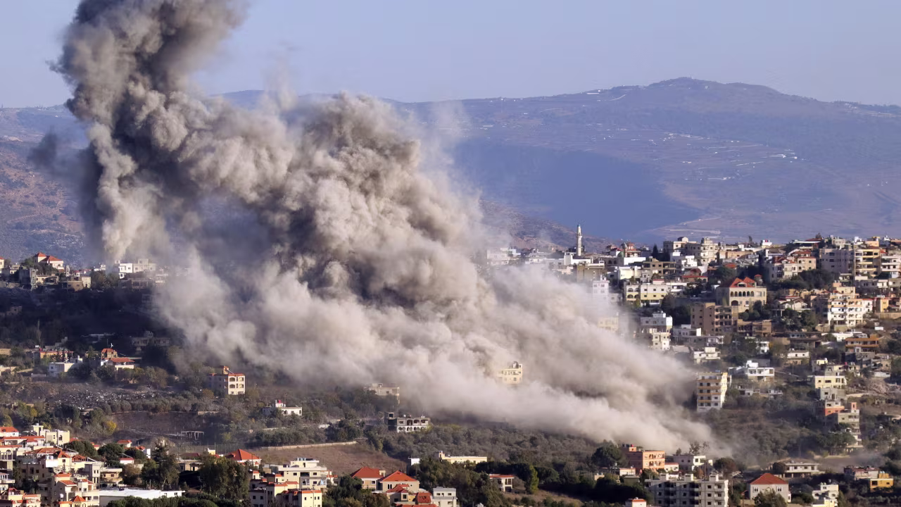 Smoke rises from the site of an Israeli air strike on Khiam in southern Lebanon near the border with Israel on October 25.