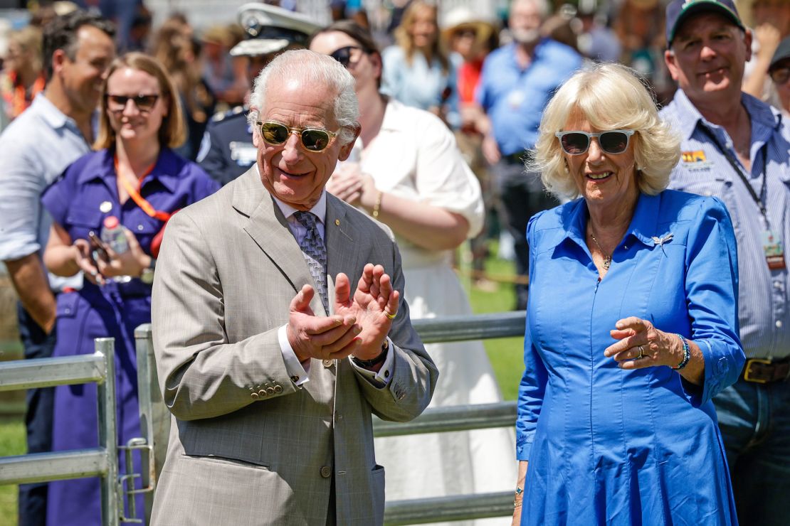 King Charles III and Queen Camilla view a sheep dog demonstration as they attend a community BBQ on October 22 in Sydney.