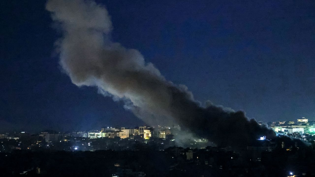 TOPSHOT - Smoke rises from the site of an Israeli air strike on a neighbourhood in Beirut's southern suburbs on October 25, 2024. Israel expanded operations in Lebanon nearly a year after Hezbollah began exchanging fire in of its ally, Hamas, following the Palestinian group's deadly attack on Israel on October 7, 2023. (Photo by IBRAHIM AMRO / AFP) (Photo by IBRAHIM AMRO/AFP via Getty Images)