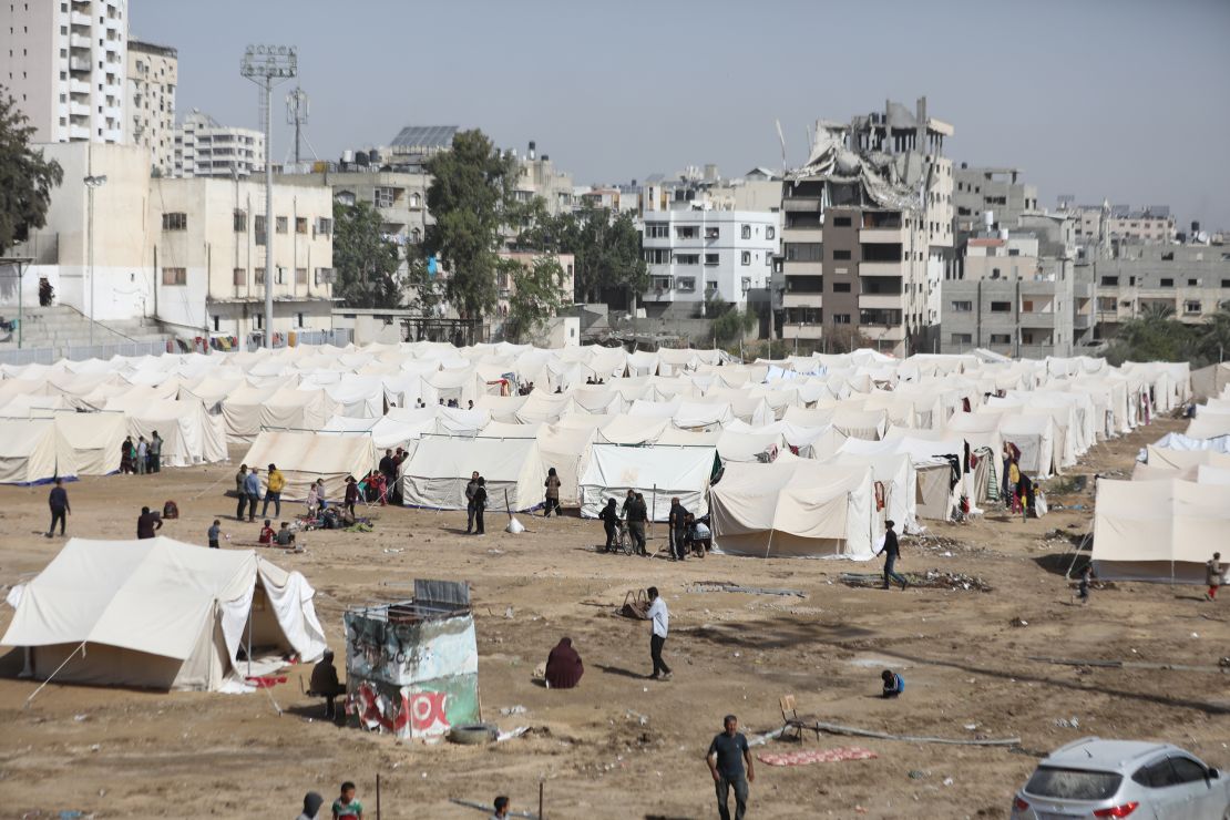 GAZA CITY, GAZA - OCTOBER 26: Hundreds of families fleeing Israeli army's intense attacks on Jibalya, Beit Hanoun and Beit Lahia in northern Gaza shelter in the tent camp established at the Yarmouk Stadium, in Gaza City, Gaza on October 26, 2024. (Photo by Dawoud Abo Alkas/Anadolu via Getty Images)