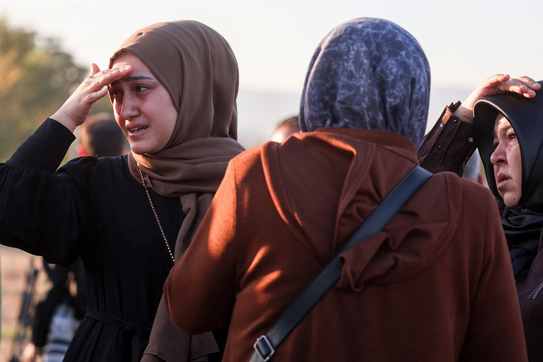 Relatives of employees watch an attack on a state-owned aerospace company near Ankara.