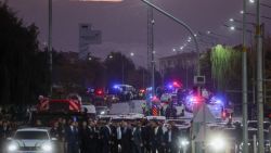 ANKARA, TURKEY - OCTOBER 23: Police and emergency services are seen on the road at the entrance of the Turkish Aerospace Industries facility after an attack on October 23, 2024 in Ankara, Turkey. Turkish President Regip Tayyip Erdogan announced that four people had been killed and fourteen wounded in the attack that was conducted by two assailants that were killed during the attack, as yet, no organization has claimed responsibility for the attack. (Photo by Serdar Ozsoy/Getty Images)