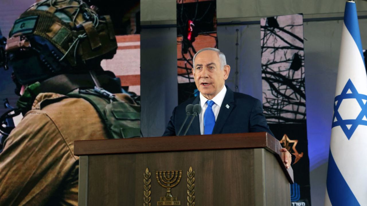 Israel's Prime Minister Benjamin Netanyahu speaks during a ceremony marking the Hebrew calendar anniversary of the Hamas attack on October 7 last year that sparked the ongoing war in Gaza, at the Mount Herzl military cemetery in Jerusalem on October 27, 2024. (Photo by GIL COHEN-MAGEN / POOL / AFP) (Photo by GIL COHEN-MAGEN/POOL/AFP via Getty Images)