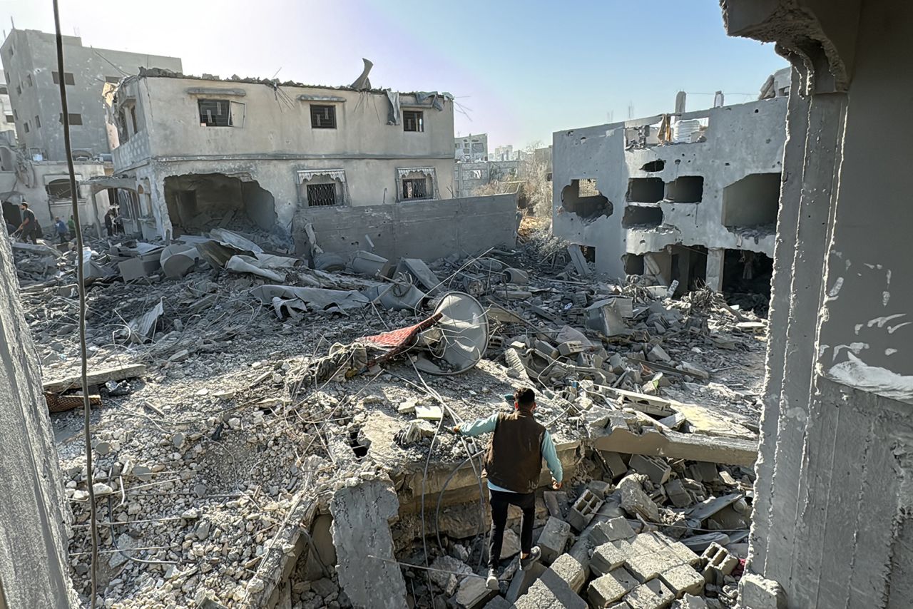 A person inspects the damage after an overnight Israeli airstrike in Beit Lahia, Gaza, on October 27.