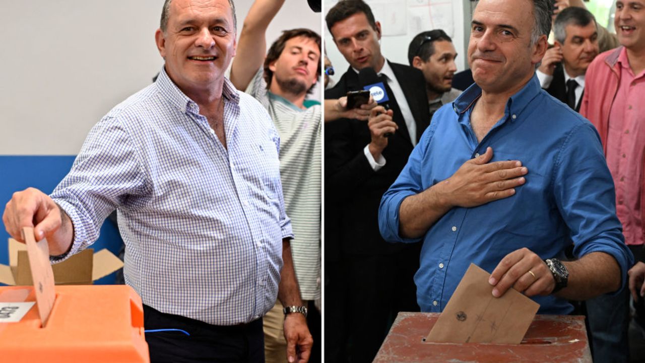 (COMBO) This combination of file pictures created on October 27, 2024, shows Uruguay's presidential candidate for the Partido Nacional (National Party), Alvaro Delgado, casting his vote during the presidential and legislative elections in Montevideo on October 27, 2024, and Uruguay's presidential candidate for the Frente Amplio party, Yamandu Orsi, gestures as he casts his vote during the presidential and legislative elections in Canelones, Uruguay, on October 27, 2024. Orsi, a leftist history teacher, and Delgado, a center-right veterinarian, will go head-to-head for the presidency of South America's most stable democracy, Uruguay, after leading a first round of voting on October 27. (Photo by SANTIAGO MAZZAROVICH / AFP) (Photo by SANTIAGO MAZZAROVICH/AFP via Getty Images)