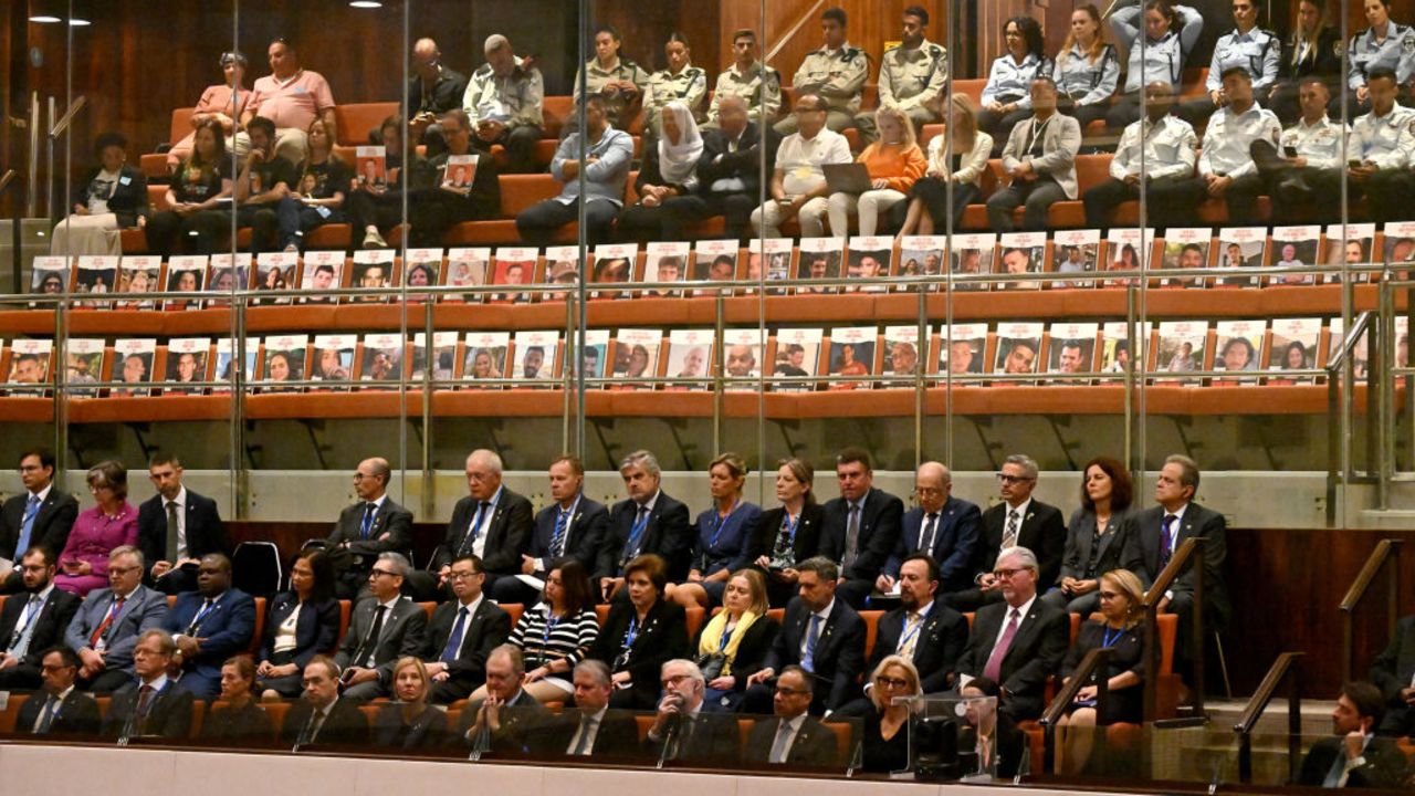 Posters with portraits of Israelis held hostage in Gaza since the October 2023 attacks by Palestinian militants, are set in empty chairs during the opening of the 25th Parliament session in Jerusalem on October 28, 2024. (Photo by DEBBIE HILL / POOL / AFP) (Photo by DEBBIE HILL/POOL/AFP via Getty Images)