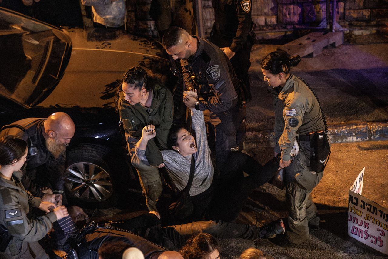 Police drag a protester away near Israeli Prime Minister Benjamin Netanyahu's residence in Jerusalem on October 28.