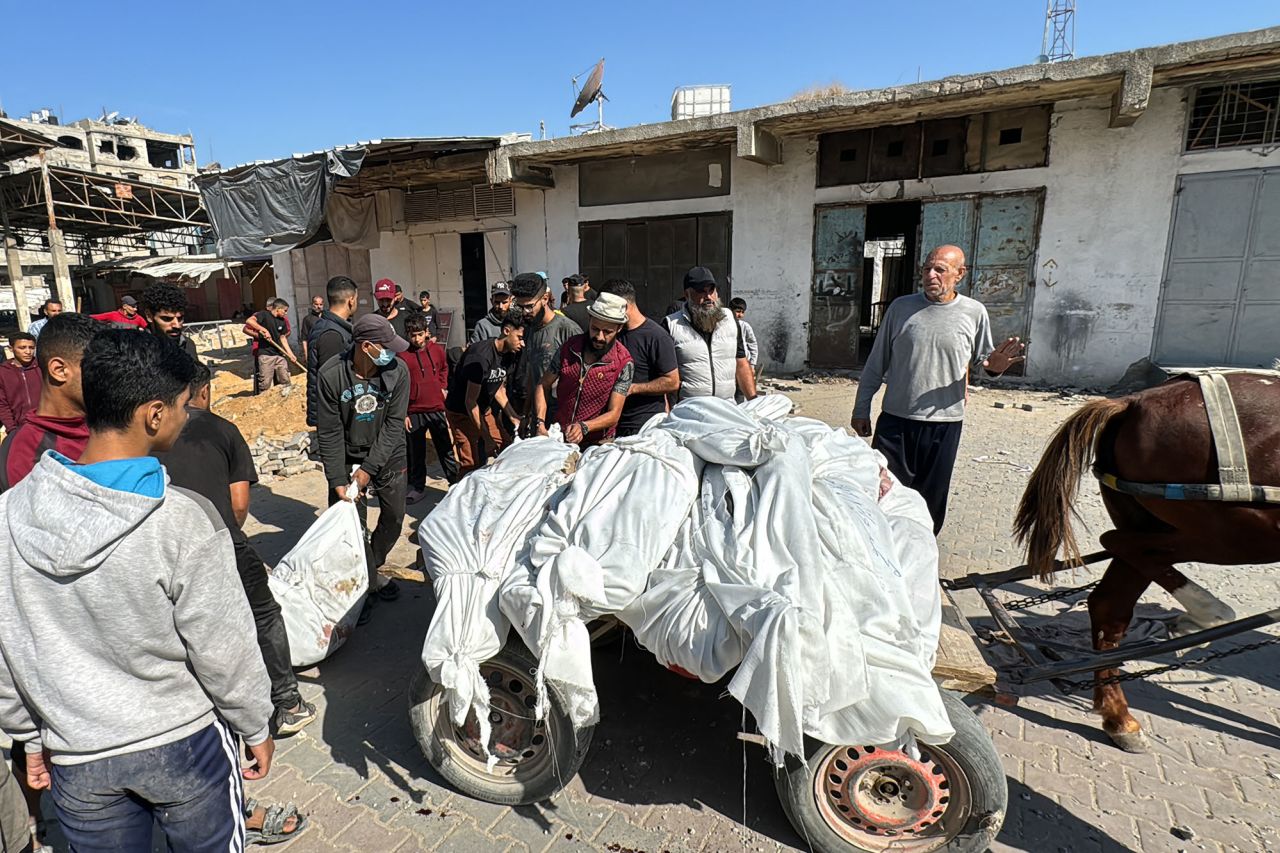 Palestinians transport bodies ahead of their funeral in Beit Lahiya, Gaza, on October 29.