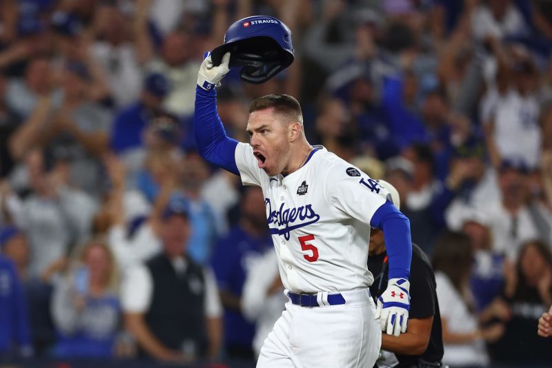 Los Angeles Dodgers' Freddie Freeman launches himself into