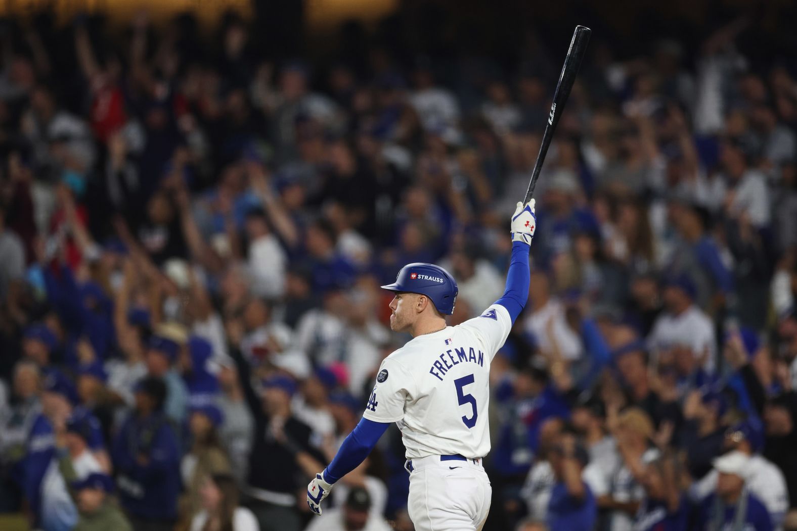 Freeman celebrates after hitting a walk-off grand slam in the 10th inning of Game 1 on Friday. The dramatic home run gave the Dodgers a 6-3 win. <a href="index.php?page=&url=https%3A%2F%2Fwww.cnn.com%2F2024%2F10%2F25%2Fsport%2Fyankees-dodgers-world-series-game-1-spt-intl%2Findex.html">It was a moment</a> that echoed one of the most famous swings in baseball history — Kirk Gibson’s walk-off home run to win Game 1 of the 1988 World Series at the same ballpark. The parallels were uncanny: Freeman, like Gibson, is hobbled by a leg injury that has nagged him throughout the playoffs, and the ball landed in the exact same grandstand that Gibson’s home run landed 36 years ago.