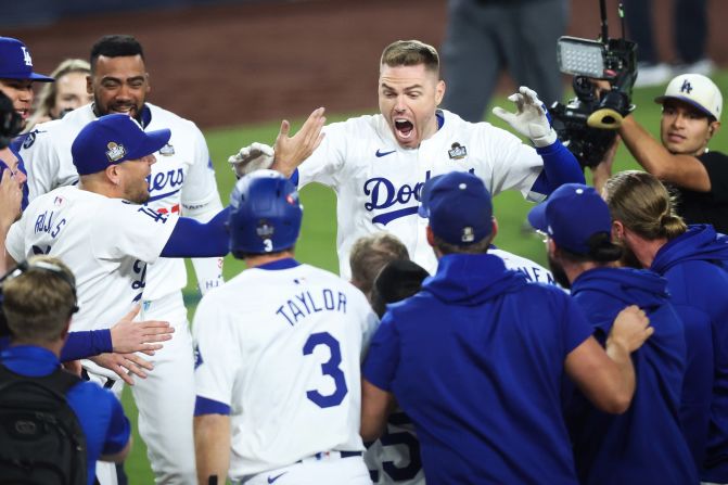 The Los Angeles Dodgers' Freddie Freeman celebrates with teammates after his walk-off grand slam.