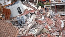 TOPSHOT - Rescuers search for missing people after the collapse of the Dubrovnik Hotel in the seaside resort of Villa Gessell, Buenos Aires province, on October 29, 2024. An elderly man was killed and a dozen people are missing after a ten-storey building housing a hotel collapsed Tuesday in the Argentine seaside resort of Villa Gesell, local authorities and media reported. (Photo by STRINGER / AFP) (Photo by STRINGER/AFP via Getty Images)