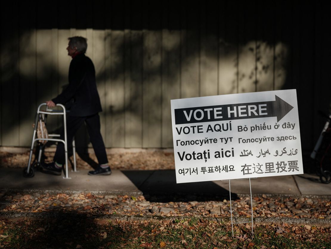 A sign showing multiple languages for voting is seen at a public library turned to an early voting station in Black Mountain, North Carolina, on October 29.