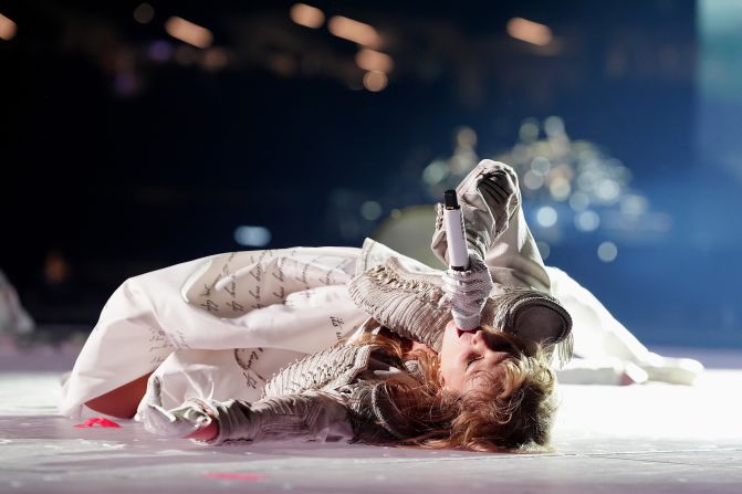 Swift lie on a stage in New Orleans while performing "The Smallest Man Who Ever Lived" in October 2024.