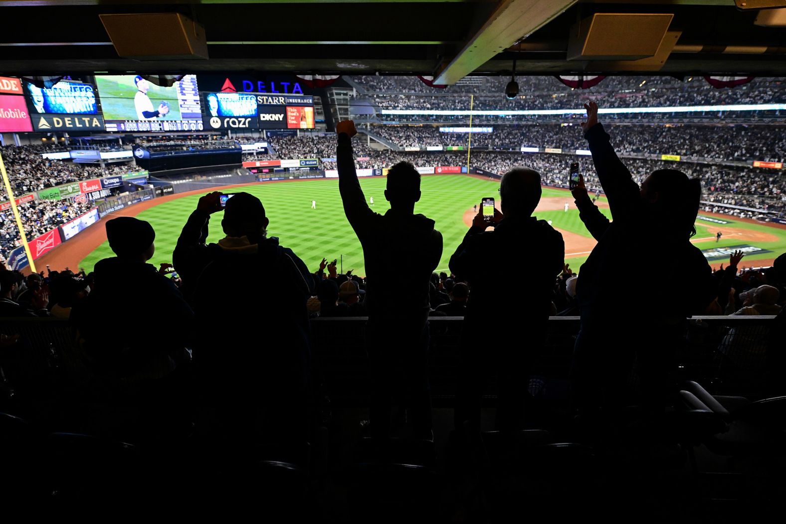 Fans celebrate after the Yankees won Game 4.