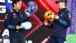 MEXICO CITY, MEXICO - OCTOBER 26: Max Verstappen of the Netherlands and Oracle Red Bull Racing and Sergio Perez of Mexico and Oracle Red Bull Racing talk to the crowd on the fan stage prior to final practice ahead of the F1 Grand Prix of Mexico at Autodromo Hermanos Rodriguez on October 26, 2024 in Mexico City, Mexico. (Photo by Mark Thompson/Getty Images)