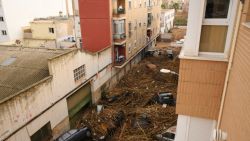 VALENCIA, SPAIN - OCTOBER 30: A street is covered with debris and piled cars after flash-flooding hit the region on October 30, 2024 in Valencia, Spain. Spanish authorities said on Wednesday that at least 52 people had died in the Valencia region overnight after flash-flooding followed heavy rain. Spain's meteorological agency had issued its highest alert for the region due to extreme rainfall. (Photo by David Ramos/Getty Images)