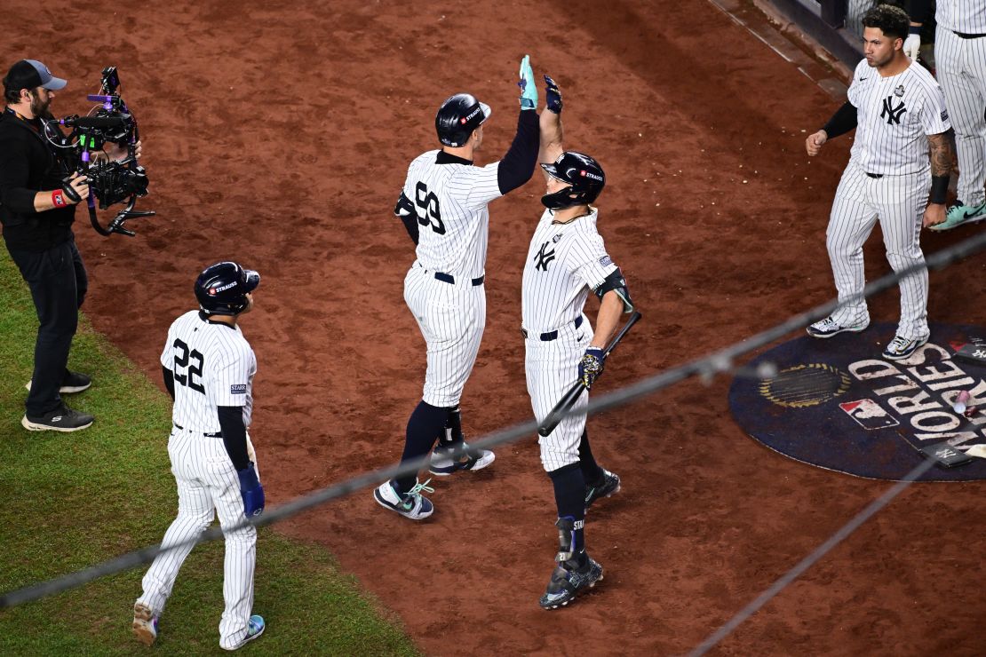 Aaron Judge celebrates after hitting his first career World Series home run in the first inning