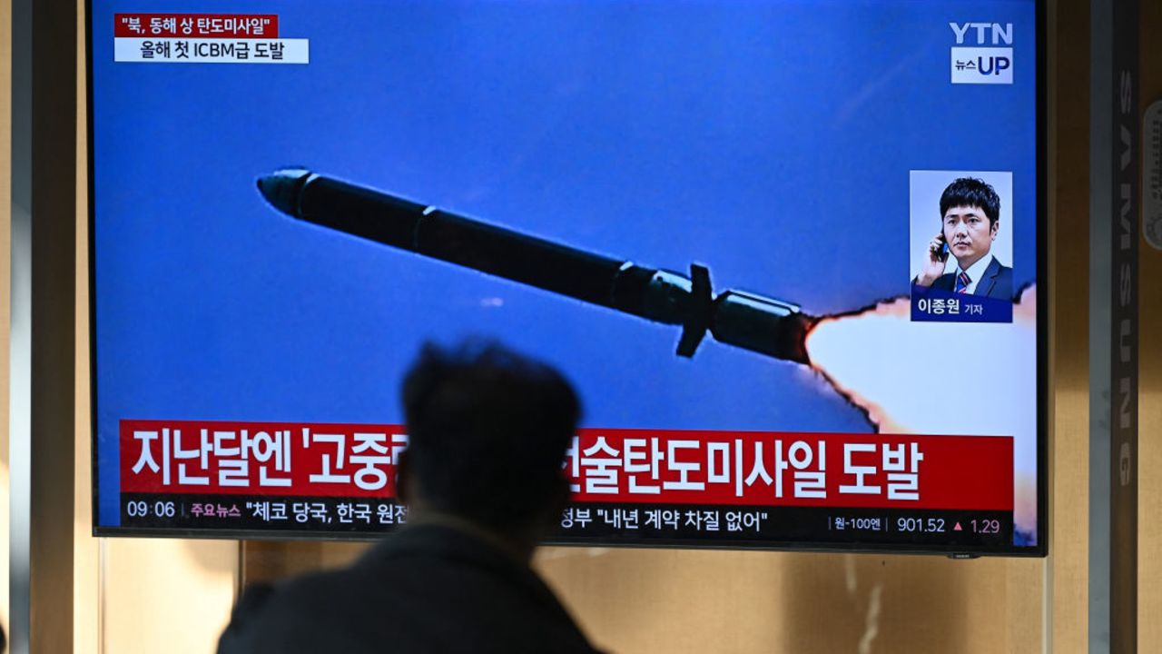 A man watches a television screen showing a news broadcast with file footage of a North Korean missile test, at a train station in Seoul on October 31, 2024. North Korea on October 31 fired a "long-range ballistic missile", South Korea's military said, Pyongyang's first weapons test since Seoul accused it of sending tens of thousands of soldiers to Russia. (Photo by JUNG YEON-JE / AFP) (Photo by JUNG YEON-JE/AFP via Getty Images)