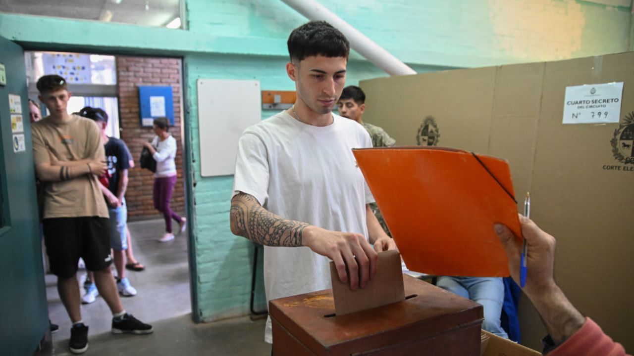 CIUDAD DE LA COSTA, URUGUAY - OCTOBER 27: A man casts his vote during the presidential election on October 27, 2024 in Ciudad de la Costa, Uruguay.  Yamandu Orsi, the center-left opposition leader from the Frente Amplio (Broad Front) party is the main challenger to the governing party’s candidate, Álvaro Delgado. (Photo by Guillermo Legaria/Getty Images)