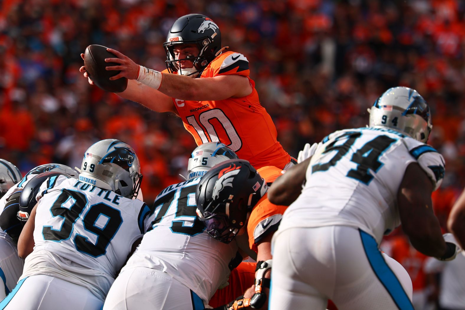 Denver Broncos quarterback Bo Nix scores a rushing touchdown in Denver on October 27. The Broncos beat the Carolina Panthers 28-14.