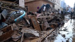 Wreckage of cars and debris are piled up in the streets of Paiporta, on October 31, 2024, covered in mud after flash floods ravaged this area of Valencia region, eastern Spain. Rescuers raced on October 31, 2024 to find survivors and victims of once-in-a-generation floods in Spain that killed at least 95 people and left towns submerged in a muddy deluge with overturned cars scattered in the streets. About 1,000 troops joined police and firefighters in the grim search for bodies in the Valencia region as Spain started three days of mourning. Up to a year's rain fell in a few hours on the eastern city of Valencia and surrounding region on October 29 sending torrents of water and mud through towns and cities. (Photo by JOSE JORDAN / AFP) (Photo by JOSE JORDAN/AFP via Getty Images)