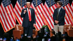 Republican presidential candidate, former President Donald Trump arrives for a live interview with commentator Tucker Carlson, during the finale of the Tucker Carlson Live Tour at Desert Diamond Arena in Glendale, Arizona, on October 31, 2024.