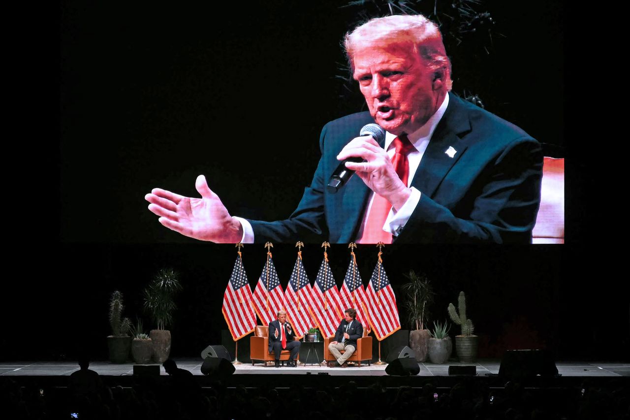 Republican presidential candidate, former President Donald Trump speaks during a live interview with Tucker Carlson in Glendale, Arizona, on October 31, 2024.