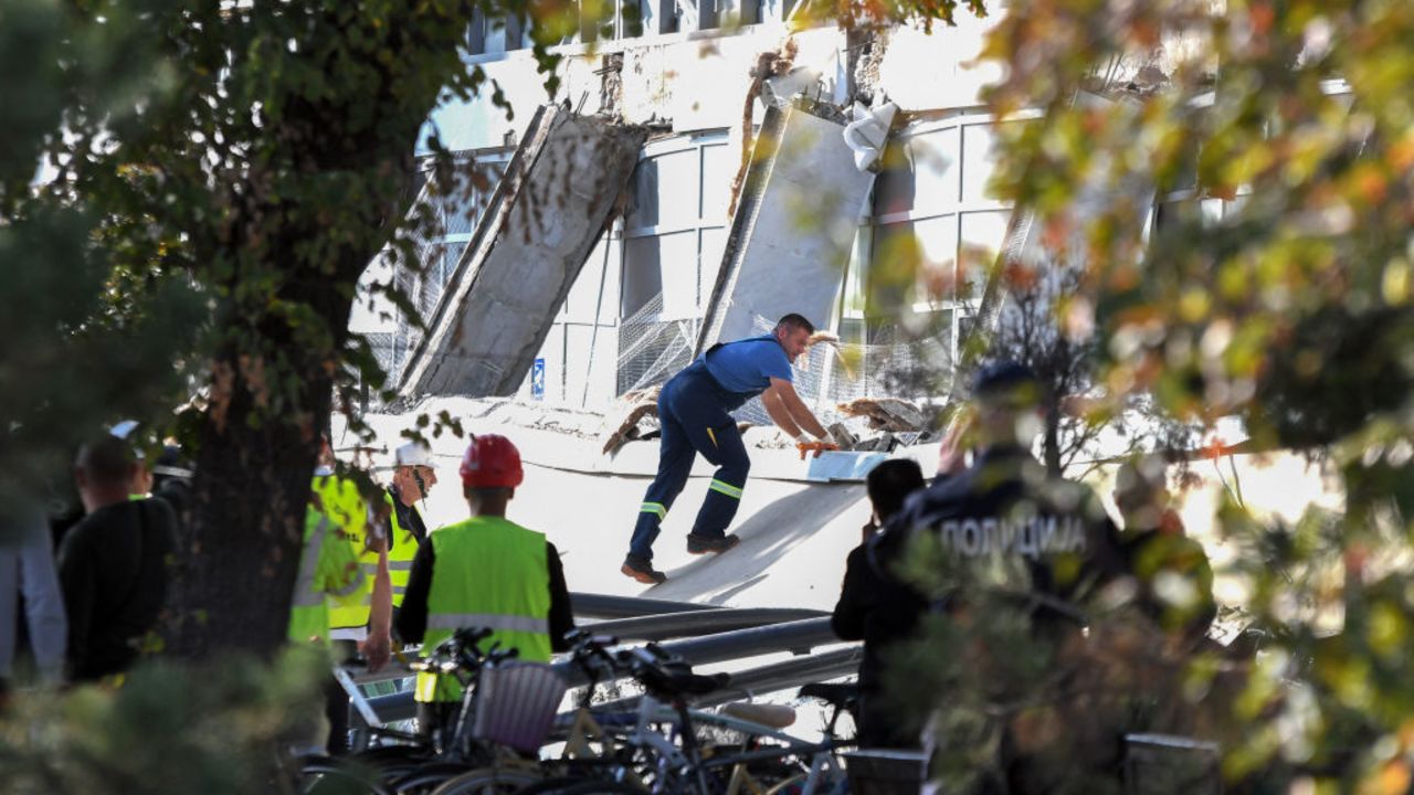 Emergency personnel and police officers work at the site where a concrete outdoor roof of a train station collapsed in the northern Serbian city of Novi Sad on November 1, 2024. At least eight people were killed November 1, 2024 after part of an outdoor roof collapsed at a train station in the Serbian city of Novi Sad, the interior minister said. (Photo by Nenad Mihajlovic / AFP) (Photo by NENAD MIHAJLOVIC/AFP via Getty Images)