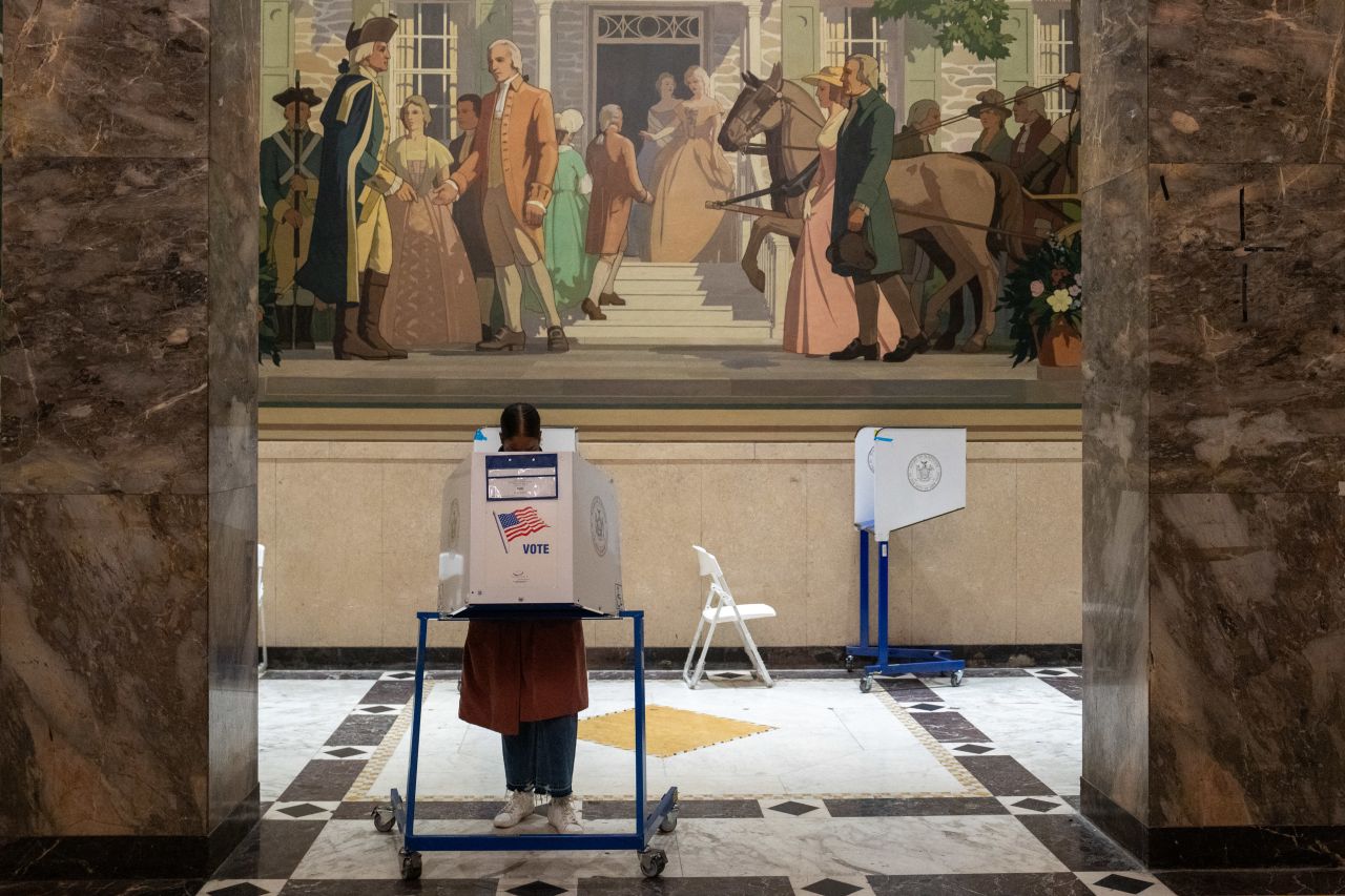 A voter casts a ballot during early voting in New York City on November 1.