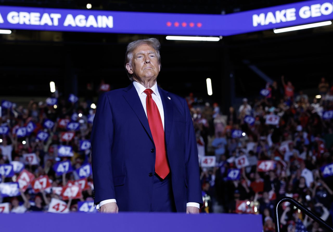 Former President Donald Trump is seen on stage at a campaign rally in Atlanta on October 28.