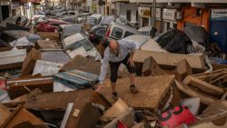 UTIEL, SPAIN - OCTOBER 30:  A man walks through a debris-covered street after flash floods hit the region on October 30, 2024 in the Sedaví area of Valencia, Spain. Spanish authorities said on Wednesday that at least 62 people had died in the Valencia region overnight after flash-flooding followed heavy rain. Spain's meteorological agency had issued its highest alert for the region due to extreme rainfall. (Photo by David Ramos/Getty Images)