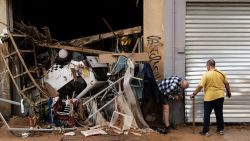 UTIEL, SPAIN - OCTOBER 30:  People check the damage of their shop after flash floods hit the region on October 30, 2024 in the Sedaví area of Valencia, Spain. Spanish authorities said on Wednesday that at least 62 people had died in the Valencia region overnight after flash-flooding followed heavy rain. Spain's meteorological agency had issued its highest alert for the region due to extreme rainfall. (Photo by David Ramos/Getty Images)