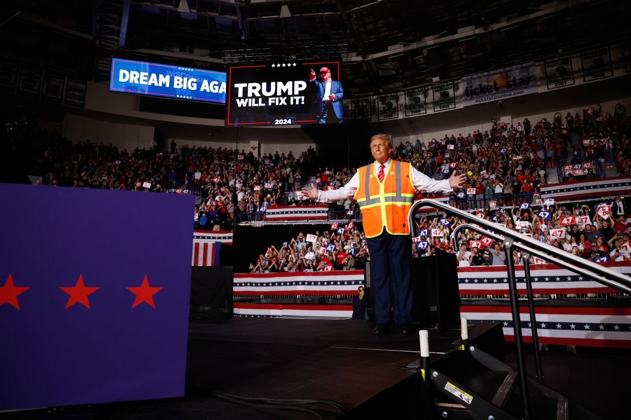 Republican presidential nominee, former President Donald Trump greets supporters during a campaign event in Green Bay, Wisconsin, on October 30.