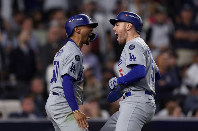 Betts and Freeman celebrate after they scored on a double by Teoscar Hernández in the fifth inning. The Dodgers scored five runs in the fifth to tie the game at 5-5.