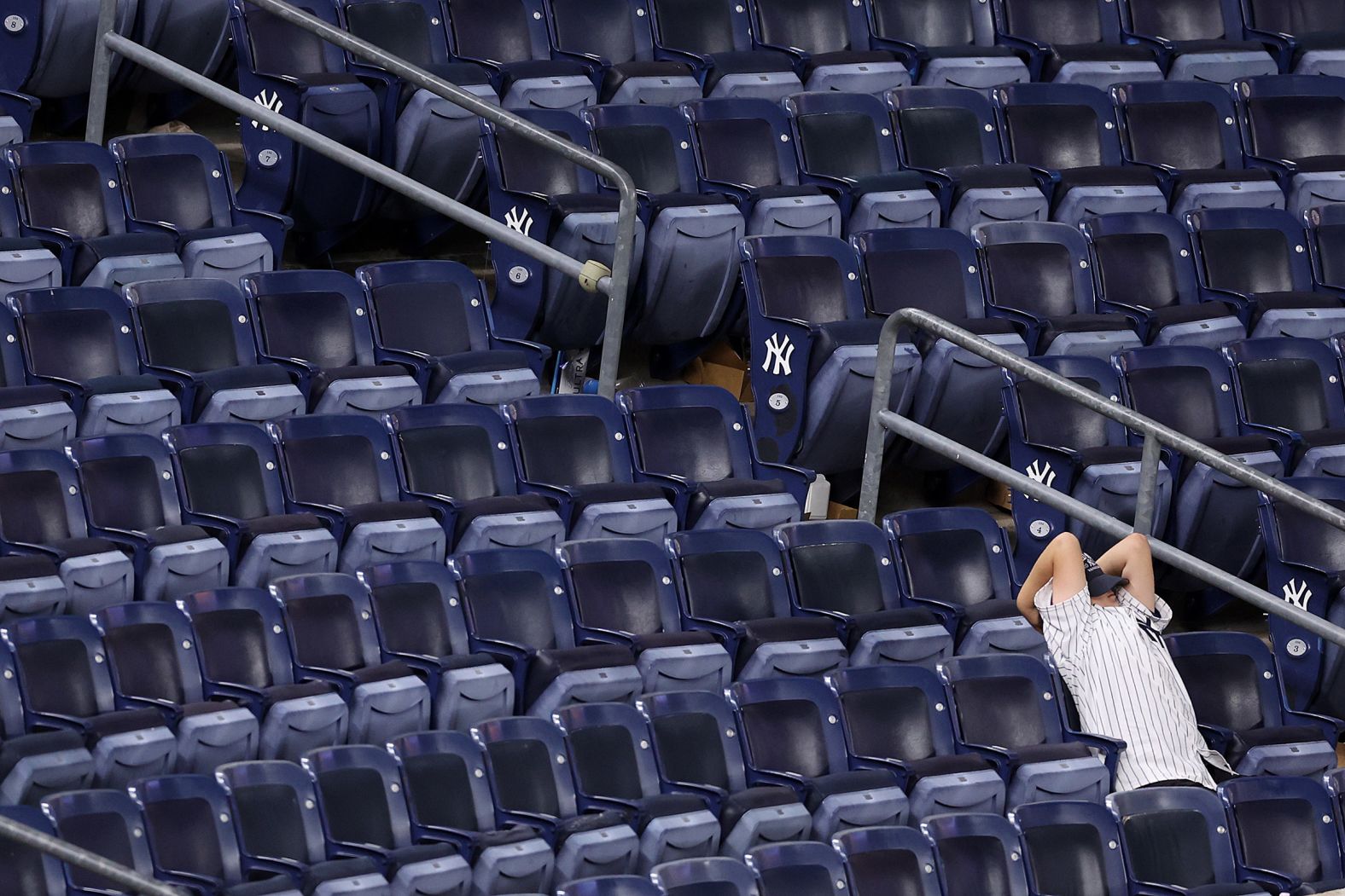 A sad Yankees fan reacts after the loss.