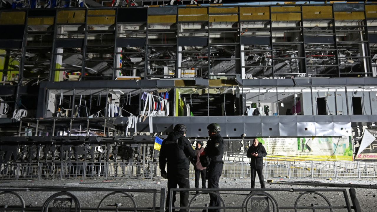 Ukrainian law enforcement officers stand next to a destroyed supermarket building following a missile attack in Kharkiv early on November 4, 2024. (Photo by SERGEY BOBOK / AFP) (Photo by SERGEY BOBOK/AFP via Getty Images)