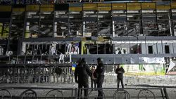 Ukrainian law enforcement officers stand next to a destroyed supermarket building following a missile attack in Kharkiv early on November 4, 2024. (Photo by SERGEY BOBOK / AFP) (Photo by SERGEY BOBOK/AFP via Getty Images)